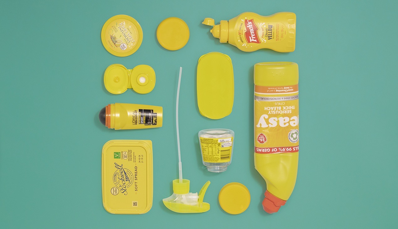 Plastic packaging waste is neatly arranged into a square